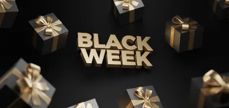 Werbung für die Black Week mit eleganten Geschenkboxen und fettem Text.