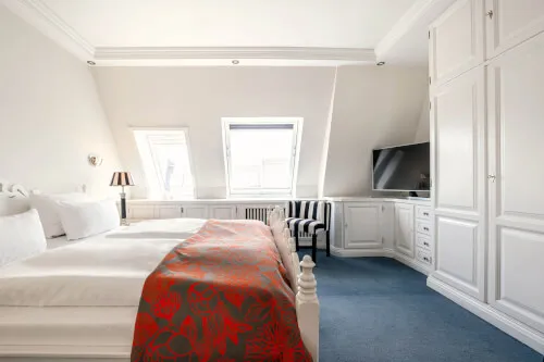 Gemütliches Zimmer im Hotel Stadt Hamburg mit elegantem Design.